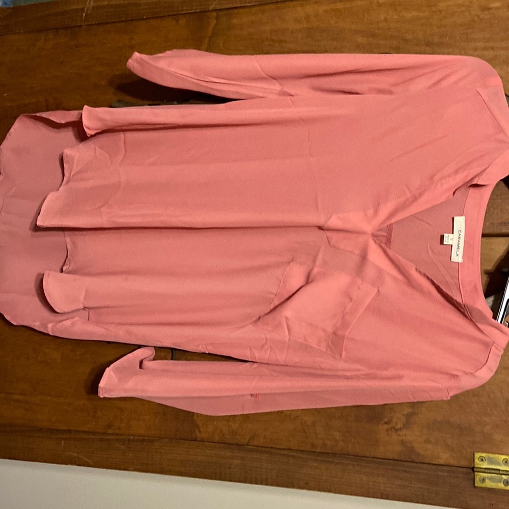 Size small light weight material. Never worn